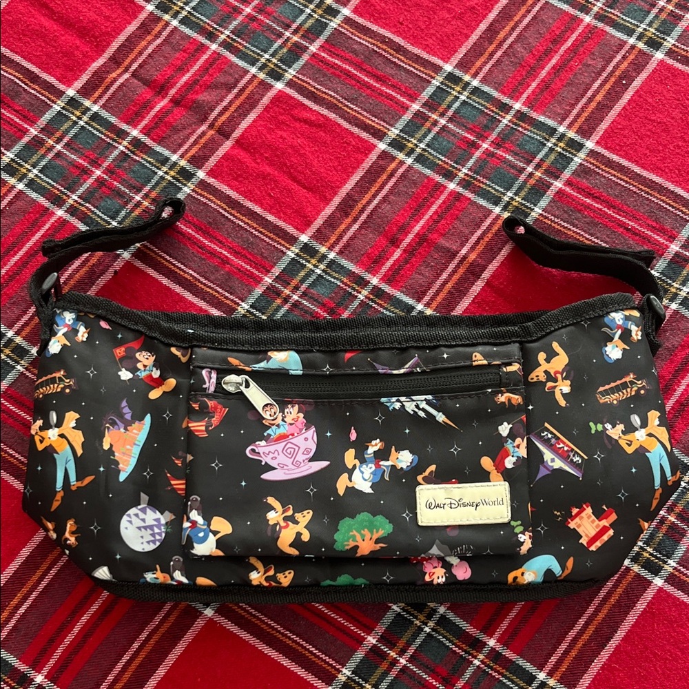 Disney Parks Stroller Organizer featuring an allover character print. GUC